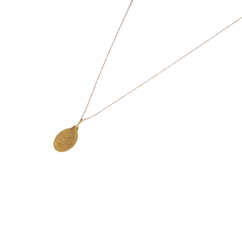 Gold necklace with a teardrop-shaped pendant on a white background back of pendant 