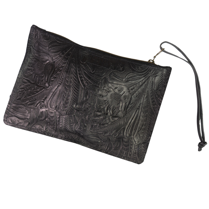Good Tidings Styke Black leather wallet, One World Traveler Clutch, with intricate embossed design on a white background