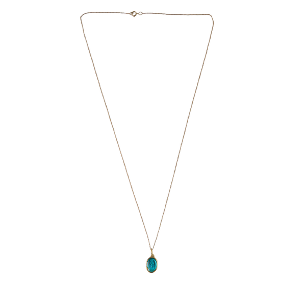 Gold Necklace with blue  medallion pendant on white background 